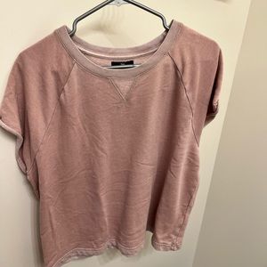 Loose pink t-shirt.